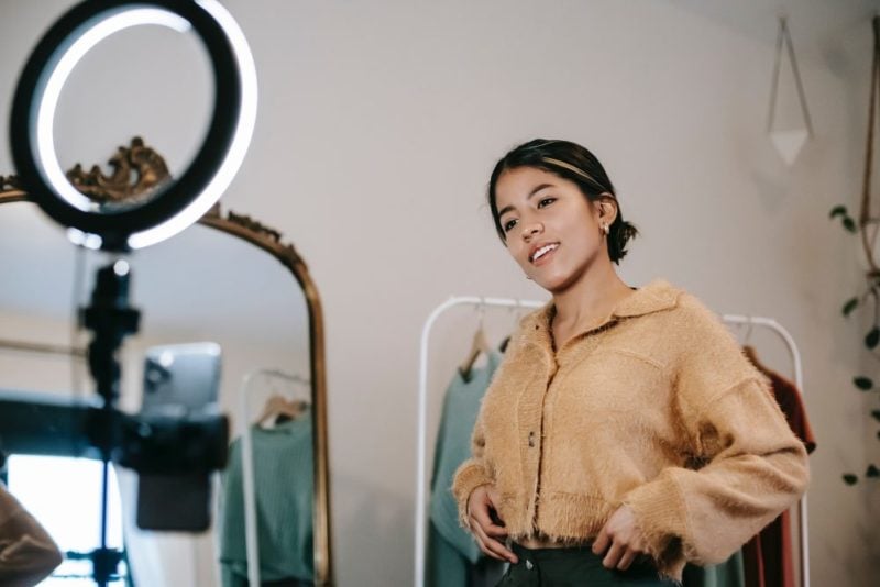 influencer marketing and woman talking at camera and light