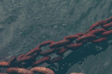 rusty chain on water