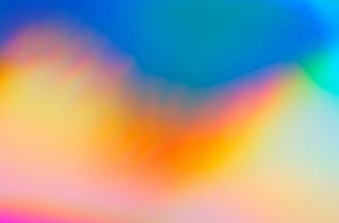 a blurry image of a rainbow colored background