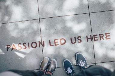 two person standing on gray tile paving