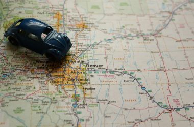 a toy car sitting on top of a map