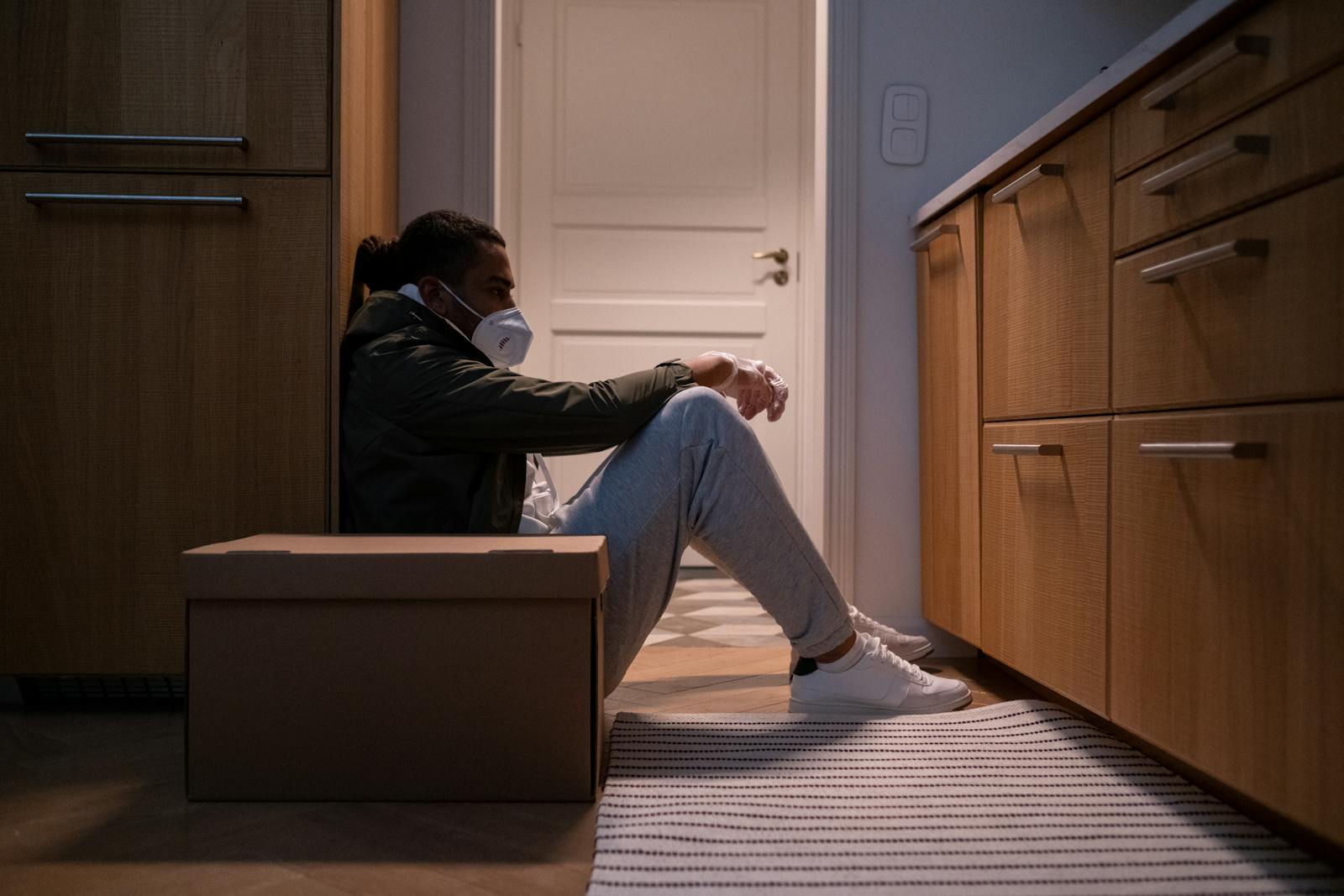 man sitting alone kitchen