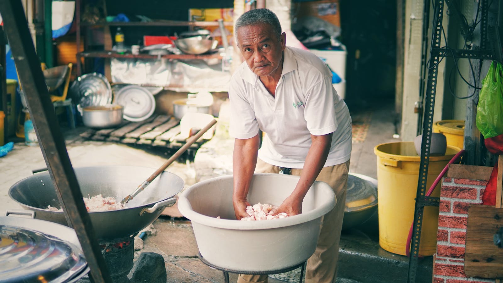 older adult cooking vegetables