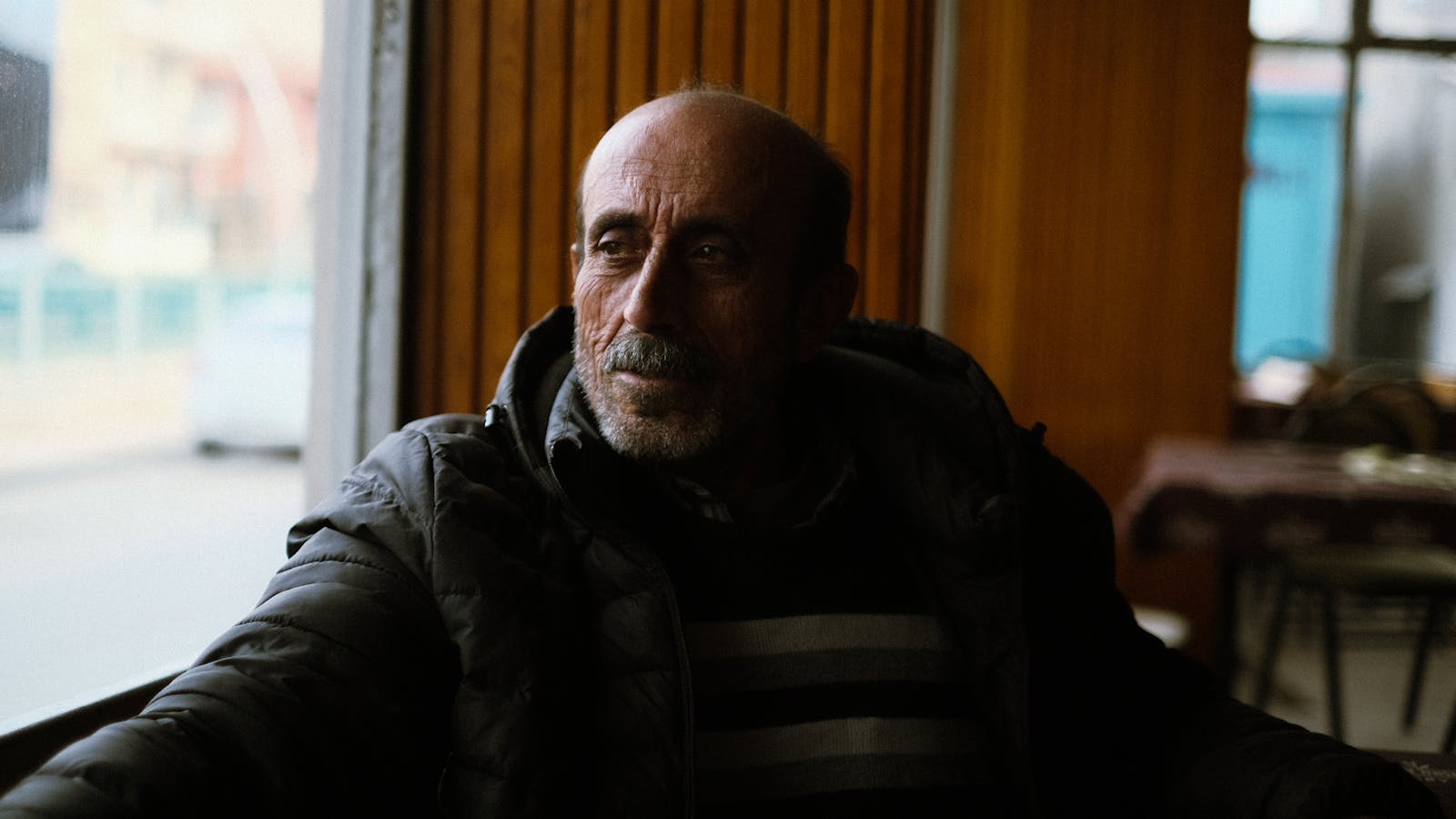 older man laughing alone