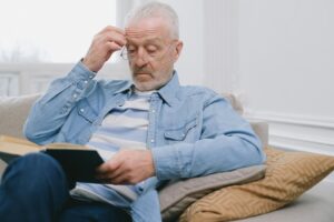 older person reading alone