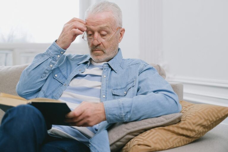 older person reading alone