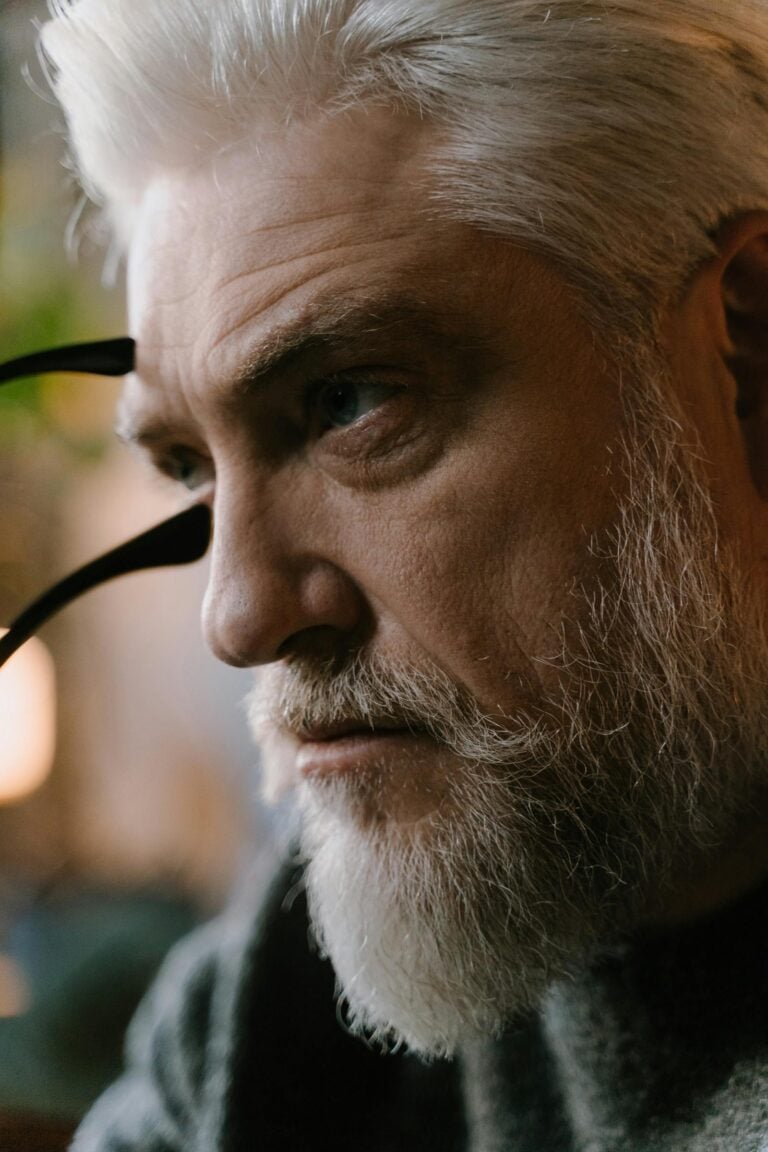 Older man in contemplation looking into the distance