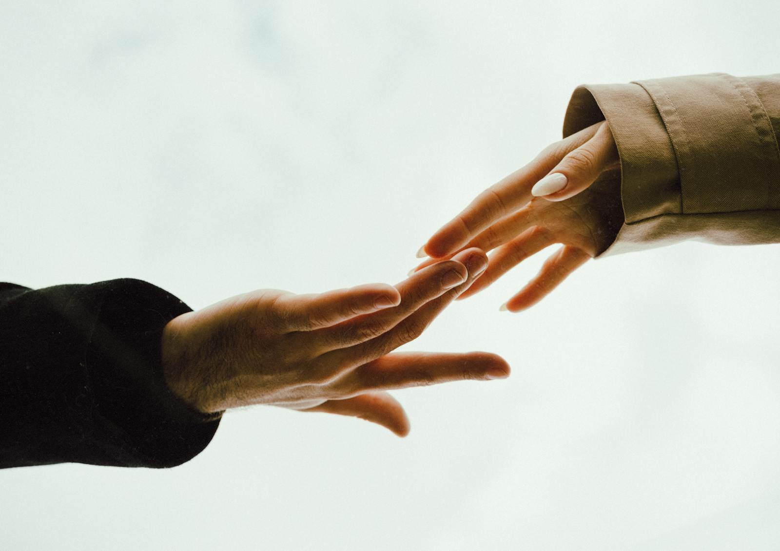 person reaching out hand