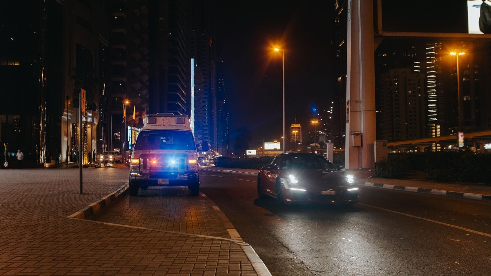 vehicles and streetlights at night