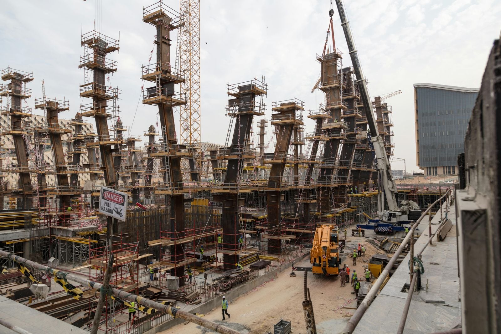 Construction site with steel frameworks and cranes