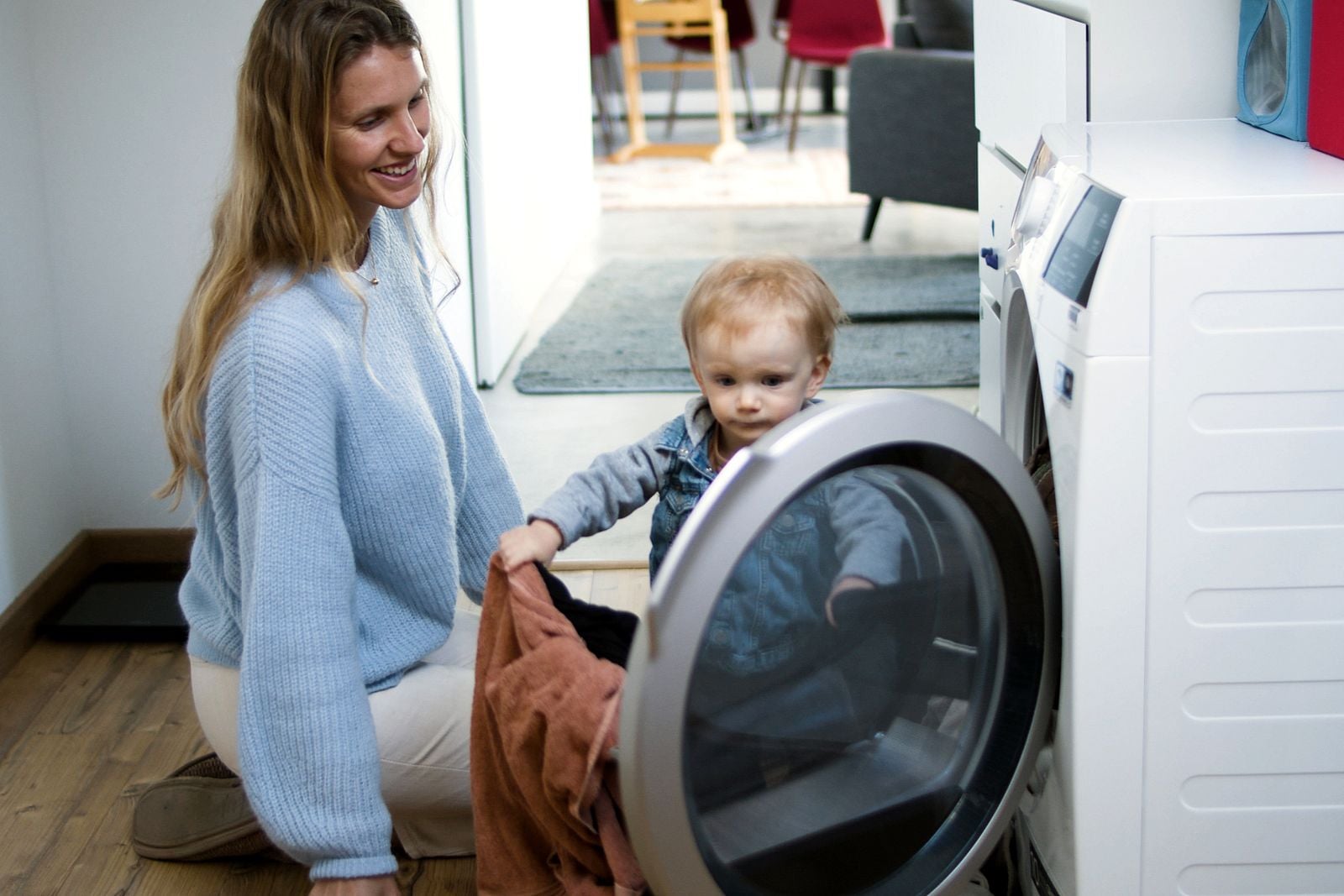 child folding laundry
