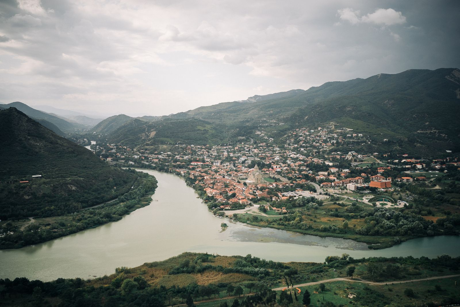 Aerial view of a river running past a town