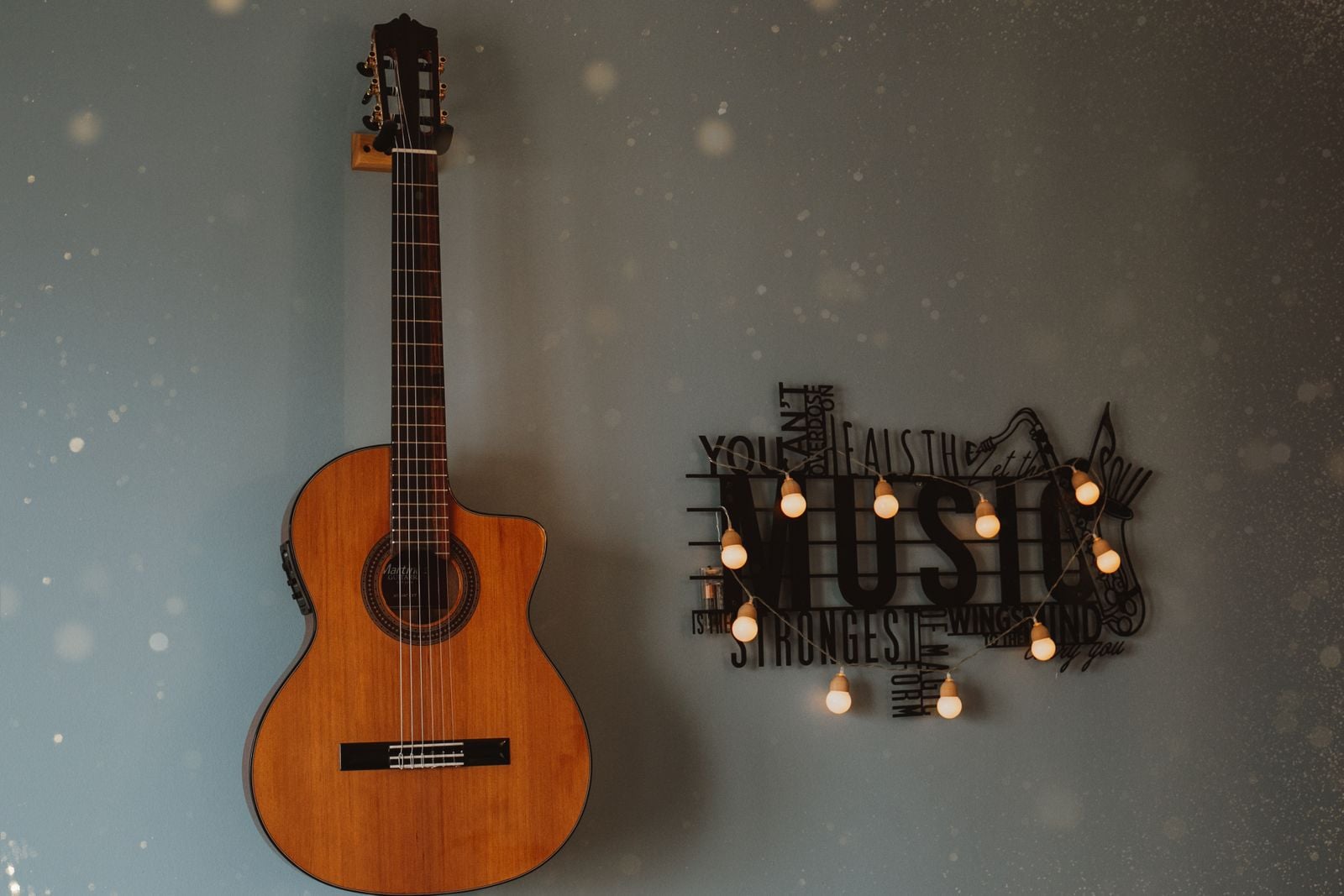 guitar leaning against wall