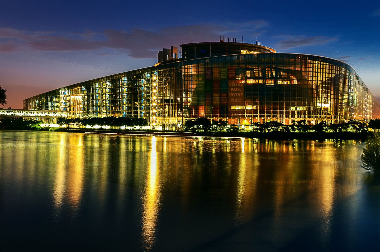 European Parliament building in Strasbourg reflected in the water at night