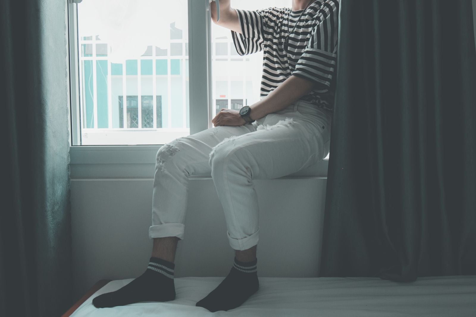 person alone window light