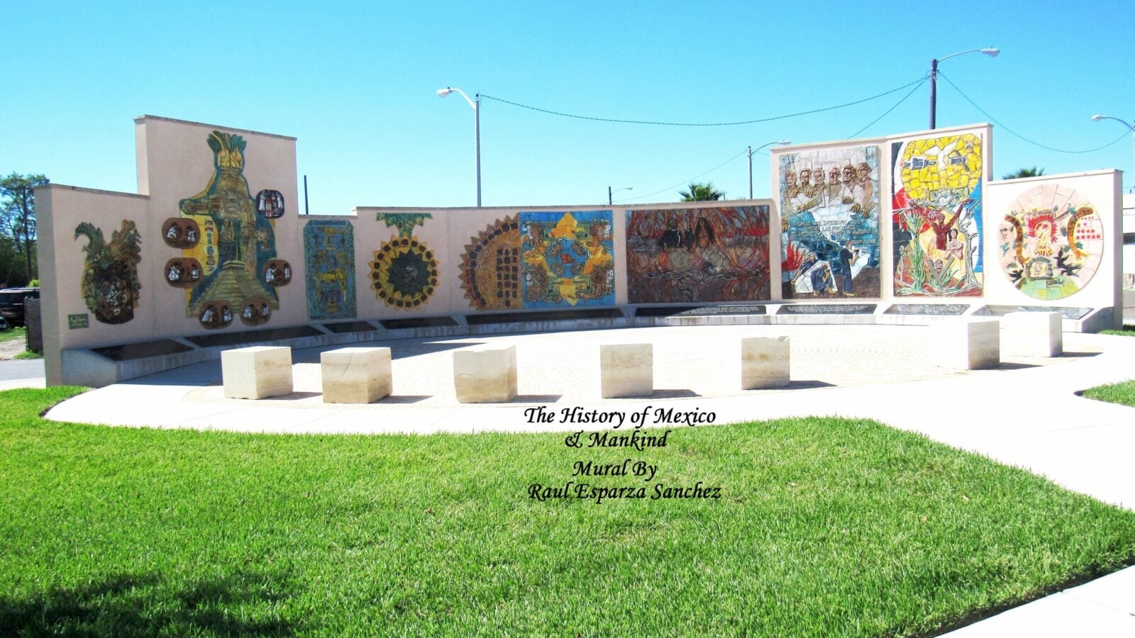 Street view in Harlingen, Texas, showing a mural and downtown buildings under a blue sky