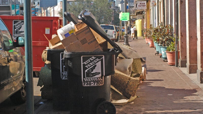 Bags of trash piled along a New Orleans street in October 2005